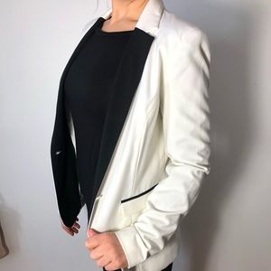 Boyfriend fit white and black trim blazer.